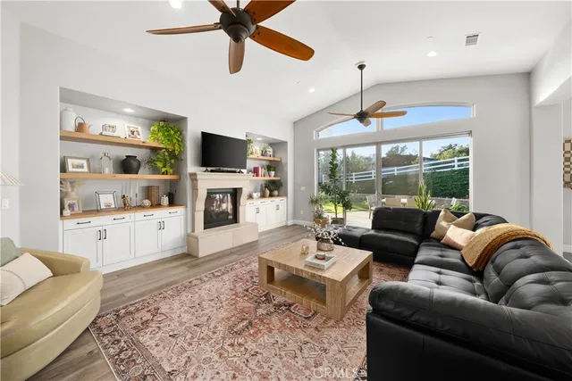 a kitchen with stainless steel appliances granite countertop a refrigerator a sink and a stove