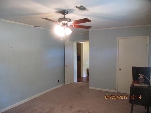 1062 Wriley Road McIntyre, GA 31054 - Photo 13 of 28 a view of an empty room with a fan