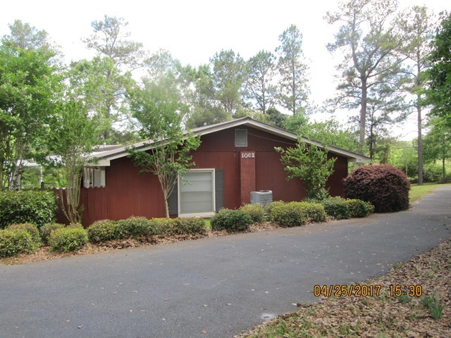 1062 Wriley Road McIntyre, GA 31054 - Photo 16 of 28 a front view of a house with yard and trees