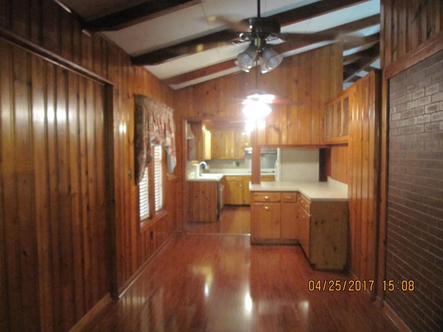 1062 Wriley Road McIntyre, GA 31054 - Photo 4 of 28 a view of a kitchen with a sink and dishwasher with wooden floor