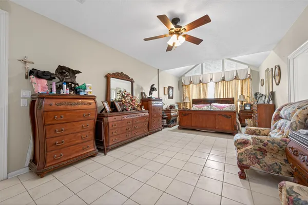 a bed room with a bed and a couch
