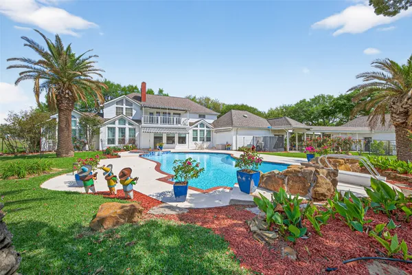 a view of a swimming pool with a lounge chairs