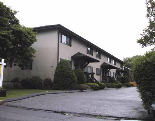 16 Lindstrom Road, Unit 6 Stamford, CT 06902 - Photo 1 of 1 a front view of a house with garden