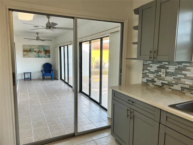 a view of a bathroom with a sink and mirror