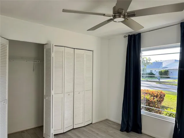 a view of an entryway with wooden floor door