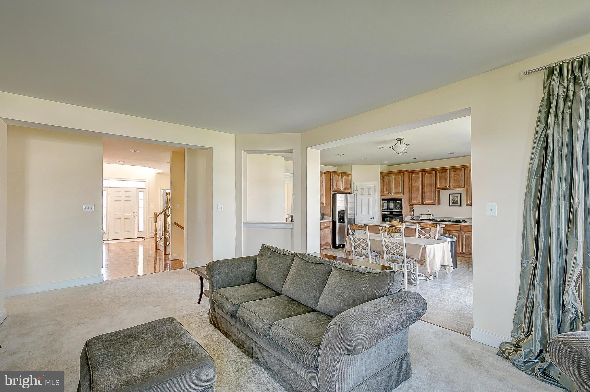 8916 Ricky Trevor Road Perry Hall, MD 21128 - Photo 4 of 30 a living room with furniture and a large window