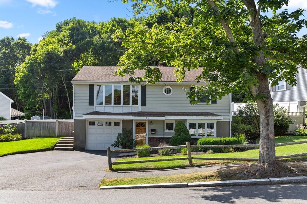 65 Moffatt Road Salem, MA 01970 - Photo 1 of 35 a front view of a house with a yard
