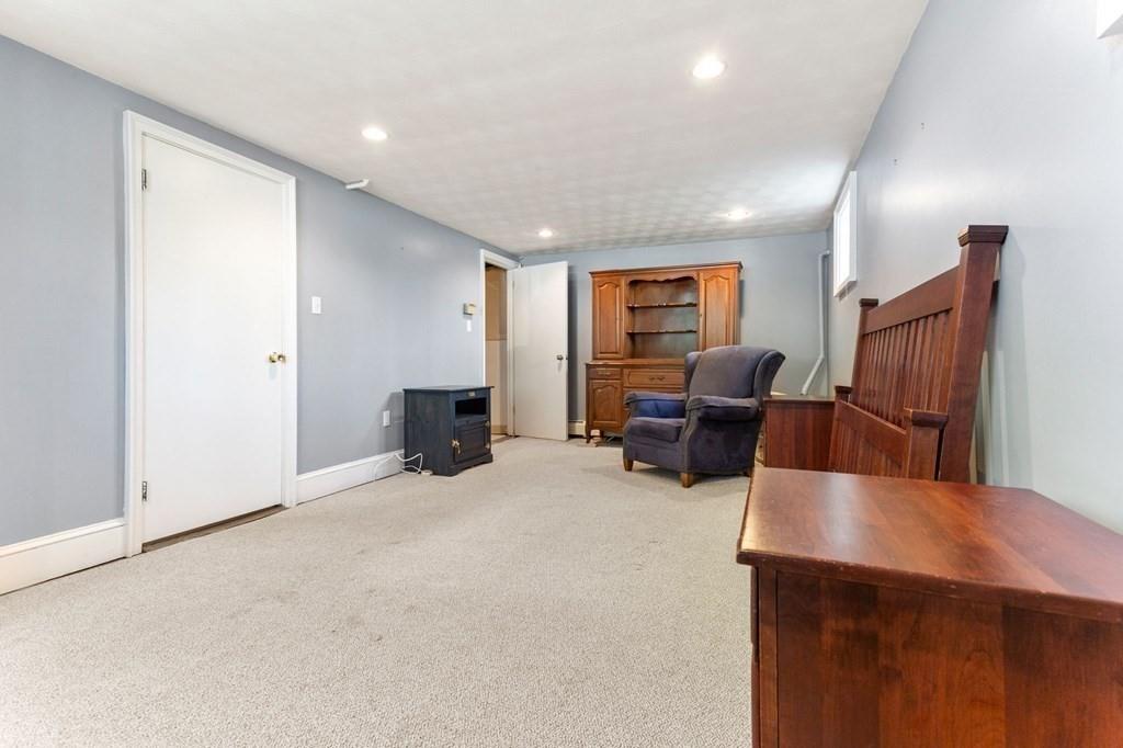65 Moffatt Road Salem, MA 01970 - Photo 22 of 35 a living room with furniture and a flat screen tv