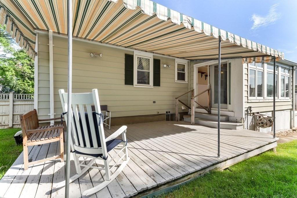 65 Moffatt Road Salem, MA 01970 - Photo 27 of 35 a view of a patio with table and chairs and wooden fence