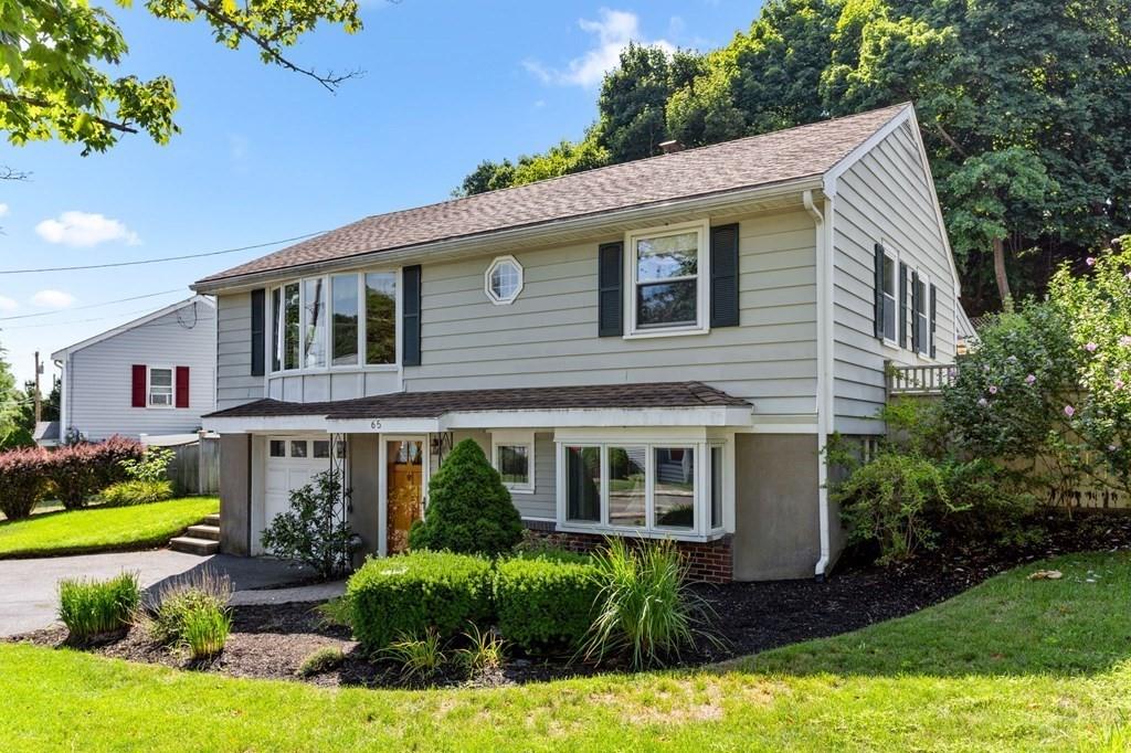 65 Moffatt Road Salem, MA 01970 - Photo 3 of 35 a front view of a house with garden and porch