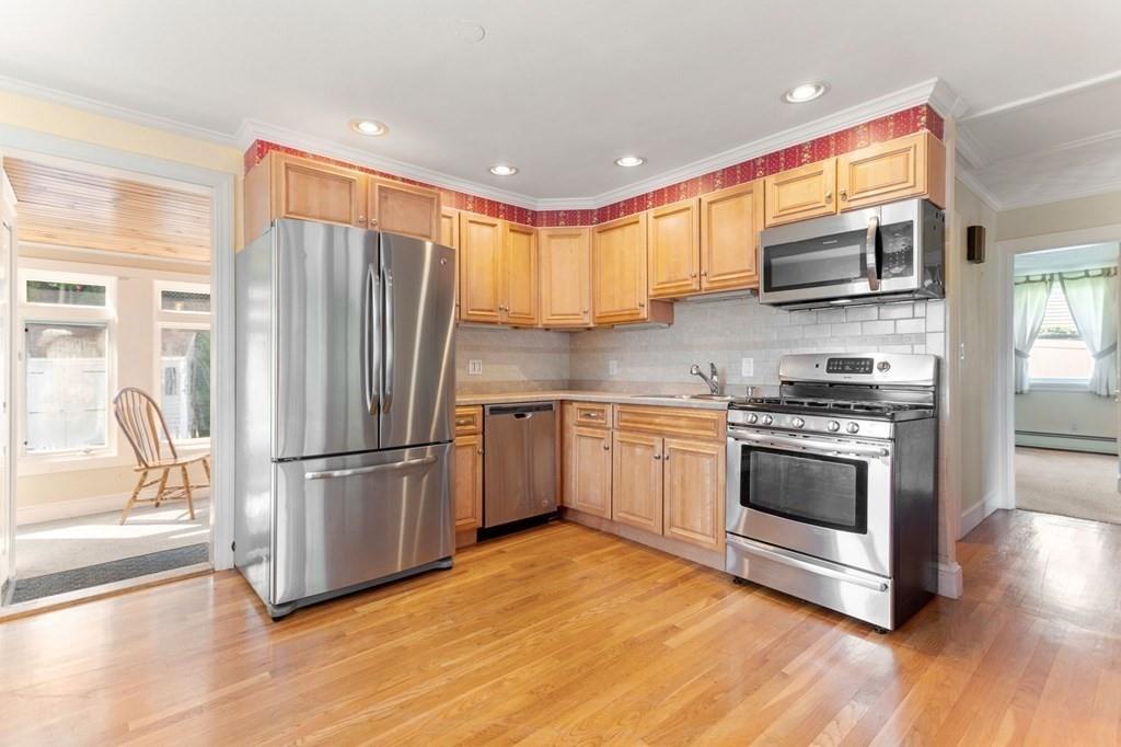65 Moffatt Road Salem, MA 01970 - Photo 4 of 35 a kitchen with stainless steel appliances a refrigerator sink and microwave