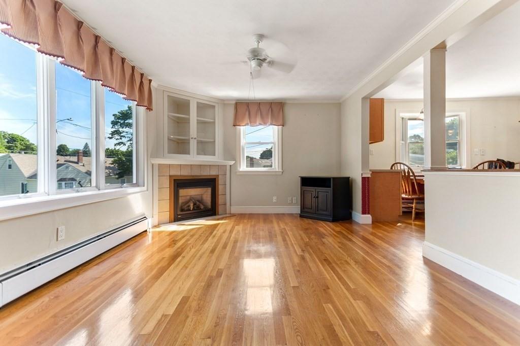 65 Moffatt Road Salem, MA 01970 - Photo 9 of 35 a view of empty room with wooden floor and fireplace