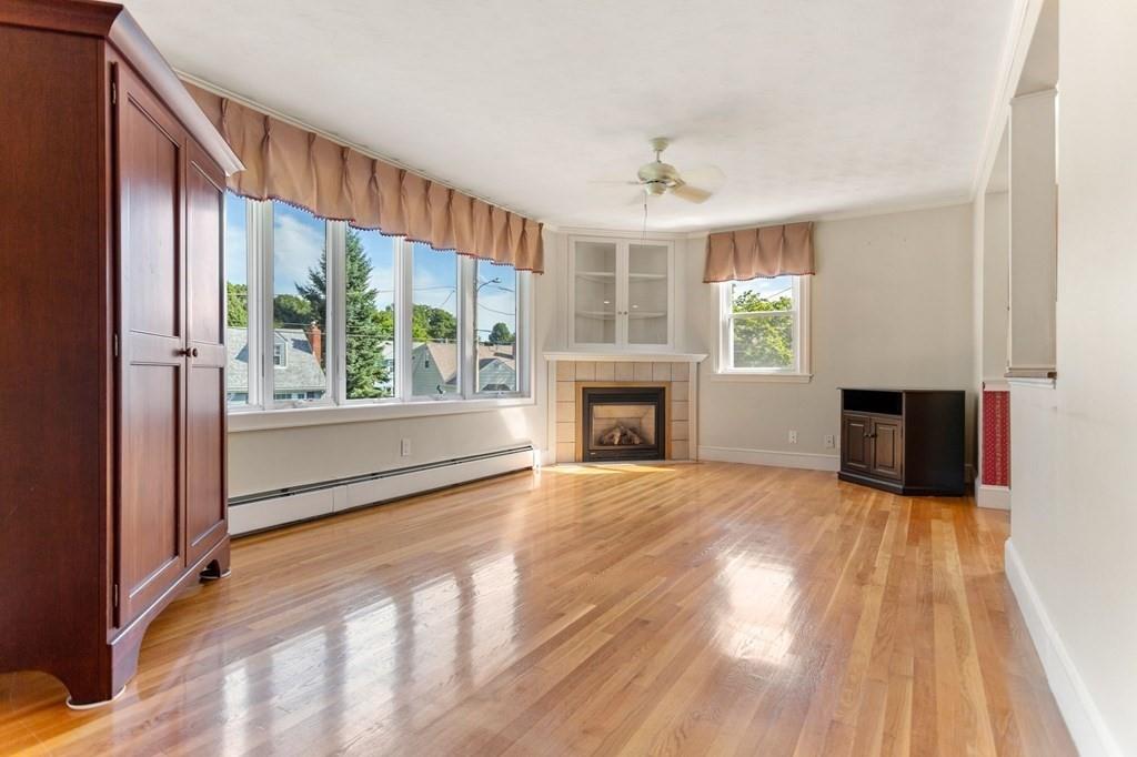 65 Moffatt Road Salem, MA 01970 - Photo 10 of 35 wooden floor fireplace and windows in an empty room