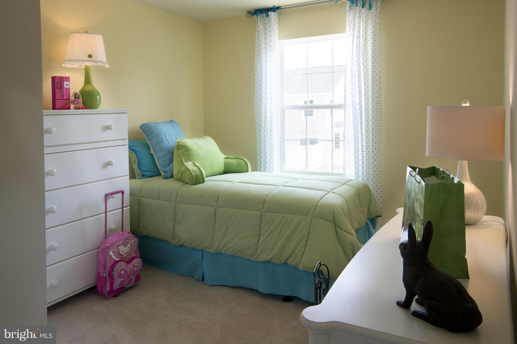 7705 Sentry Terrace Severn, MD 21144 - Photo 12 of 18 a bedroom with a bed and a window