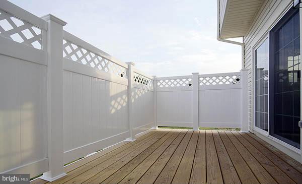 7705 Sentry Terrace Severn, MD 21144 - Photo 15 of 18 a view of a room with wooden floor