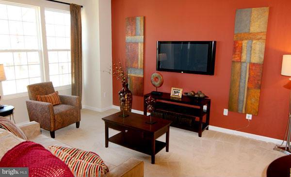 7705 Sentry Terrace Severn, MD 21144 - Photo 5 of 18 a living room with furniture and a flat screen tv