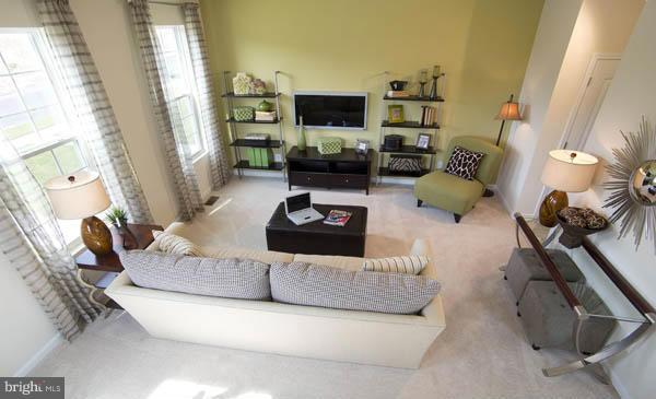 7705 Sentry Terrace Severn, MD 21144 - Photo 7 of 18 a living room with furniture and a flat screen tv
