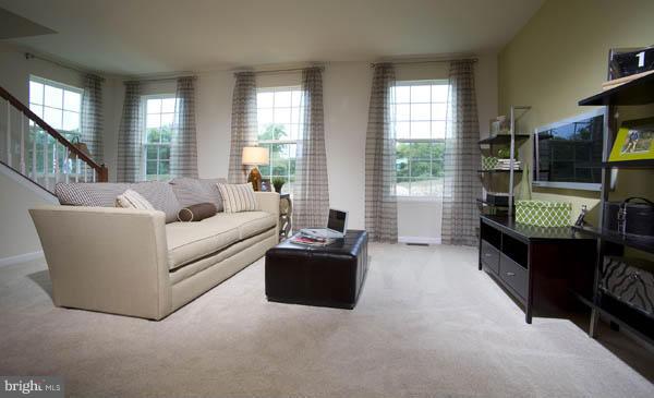 7705 Sentry Terrace Severn, MD 21144 - Photo 8 of 18 a living room with furniture and a large window