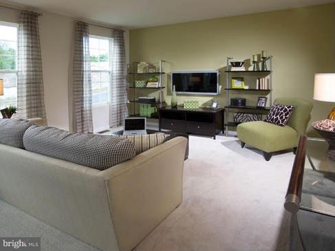 7705 Sentry Terrace Severn, MD 21144 - Photo 9 of 18 a living room with furniture and a flat screen tv