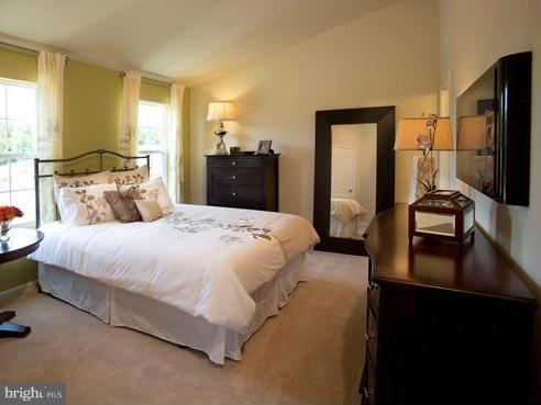 7705 Sentry Terrace Severn, MD 21144 - Photo 10 of 18 a bedroom with a bed and a television