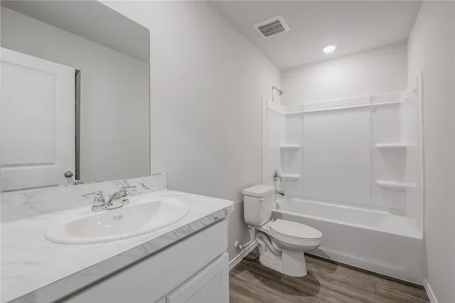 a bathroom with a sink toilet and a bathtub