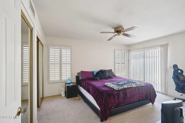 a kitchen with a refrigerator sink and cabinets