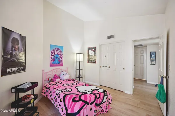 a bedroom with a bed and a window