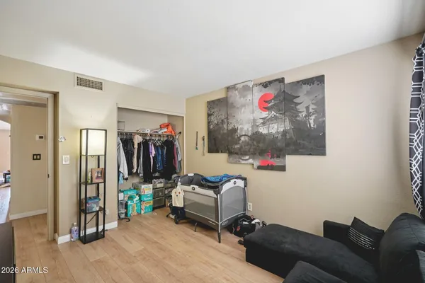 a bedroom with furniture and a window