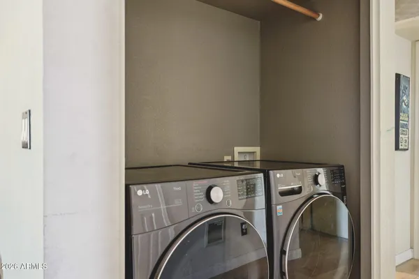 a bathroom with a sink vanity mirror and toilet