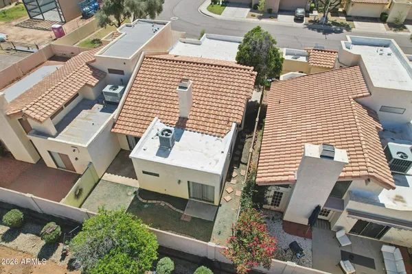 an aerial view of a house with balcony and garage