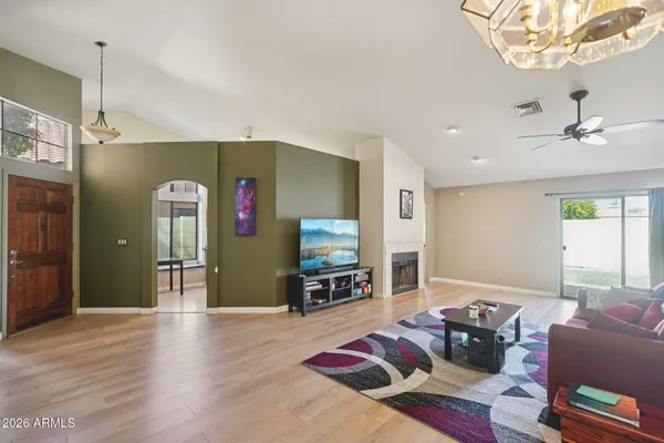a living room with furniture and a fireplace