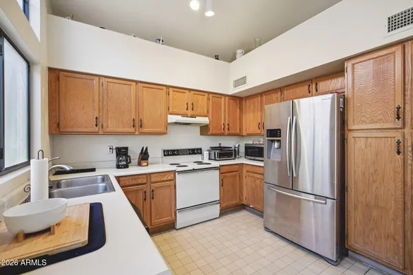 a room with a large window and furniture