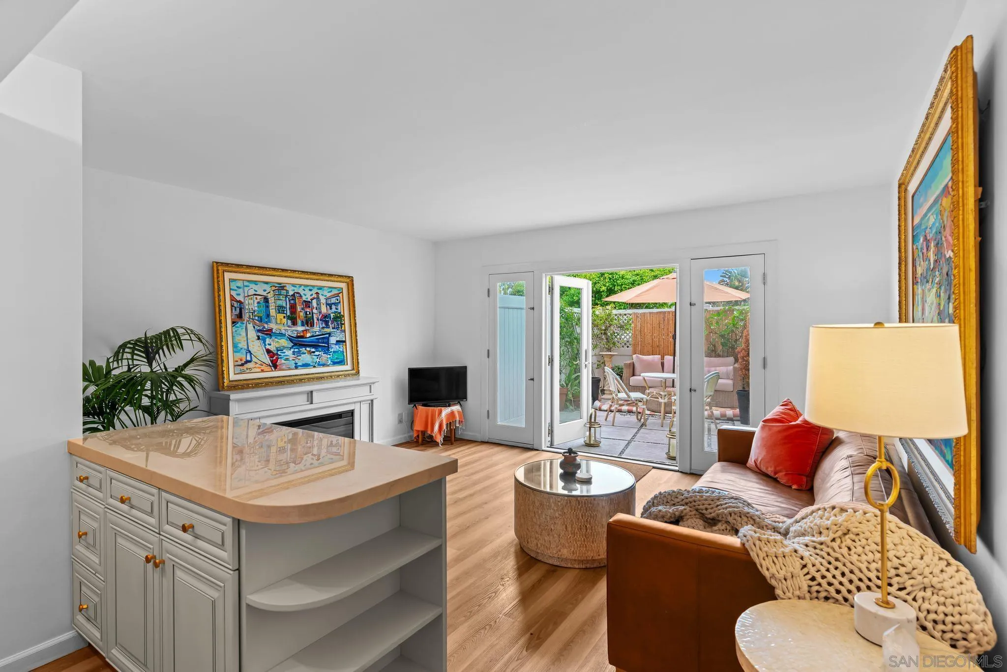 230 Prospect Street, Unit 12 La Jolla, CA 92037 - Photo 2 of 14 a living room with furniture and a large window