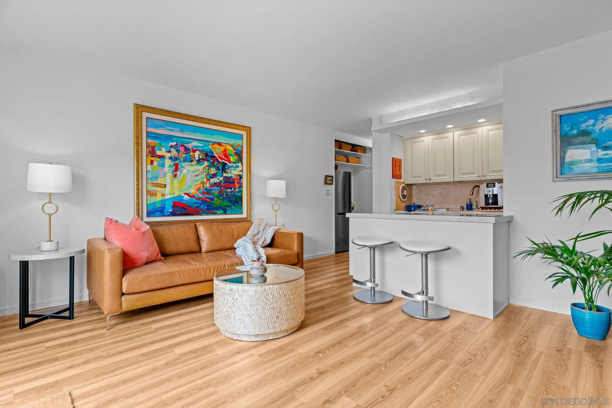 230 Prospect Street, Unit 12 La Jolla, CA 92037 - Photo 6 of 14 a living room with furniture and a potted plant