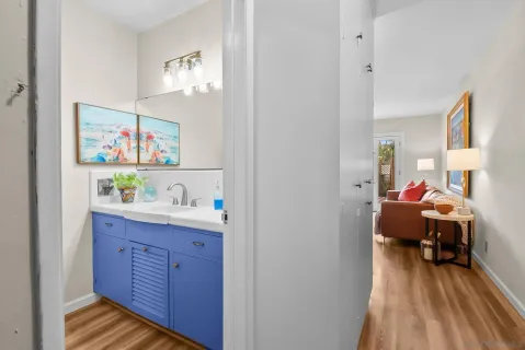 a view of a bedroom with furniture and wooden floor
