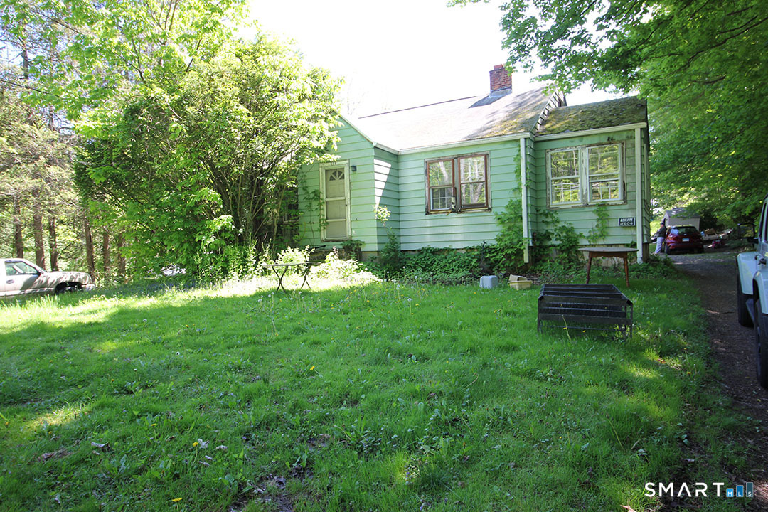 170 Ross Road Middlefield, CT 06481 - Photo 1 of 9 a view of a chair and table in backyard of the house