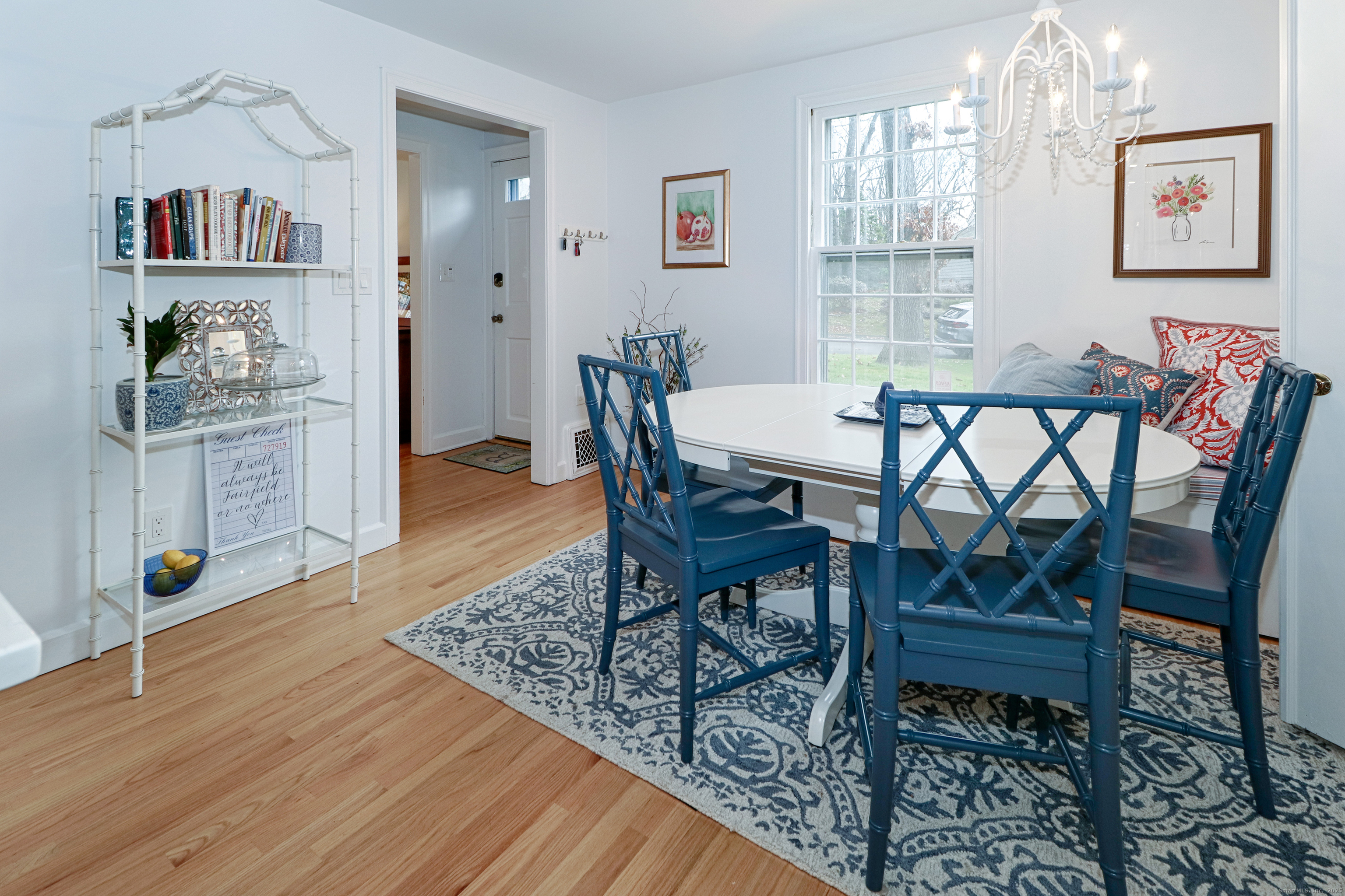 30 Falmouth Road Fairfield, CT 06825 - Photo 11 of 37 a view of a dining room with furniture and wooden floor