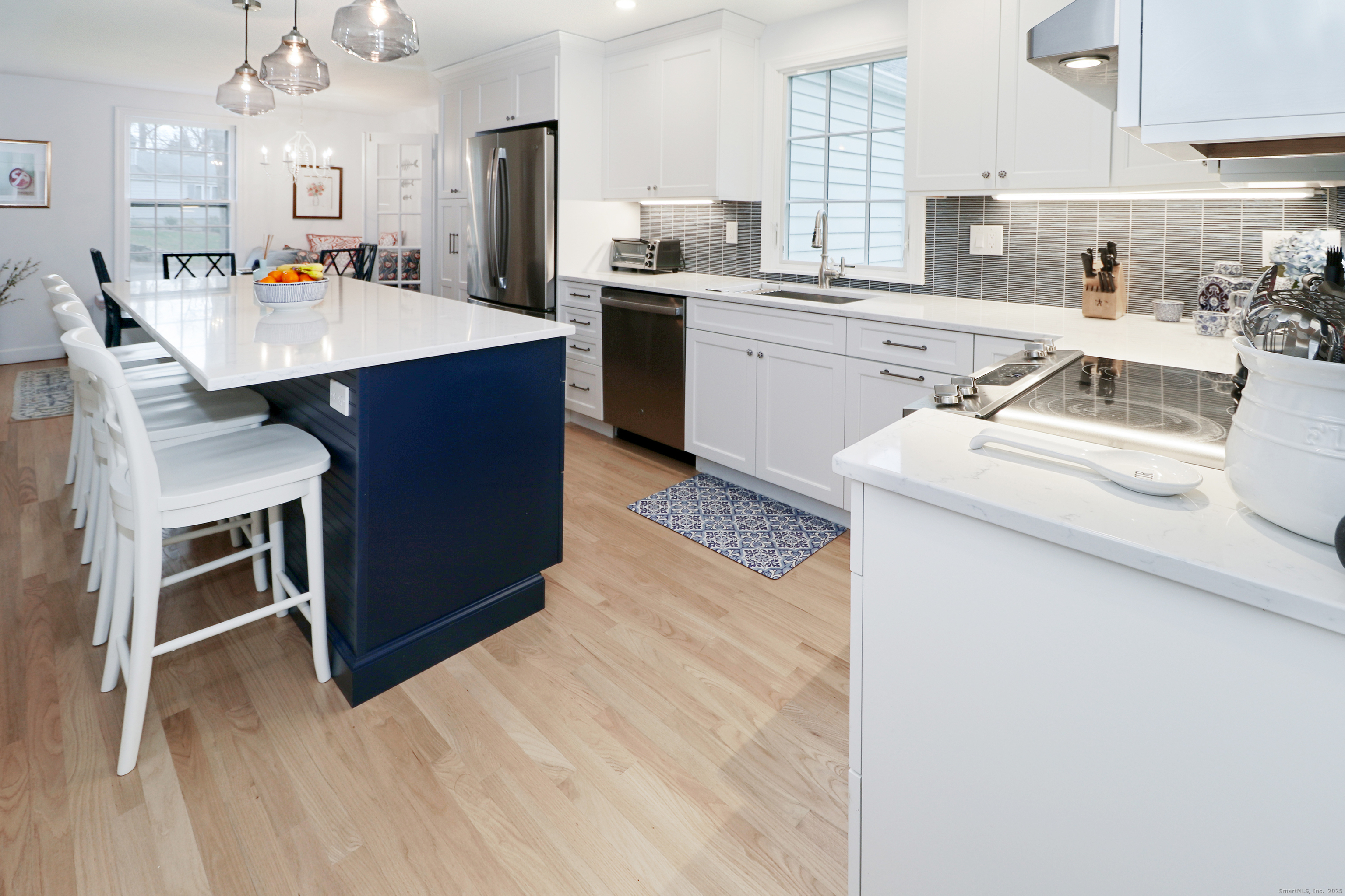 30 Falmouth Road Fairfield, CT 06825 - Photo 14 of 37 a kitchen with a sink a stove a refrigerator and cabinets