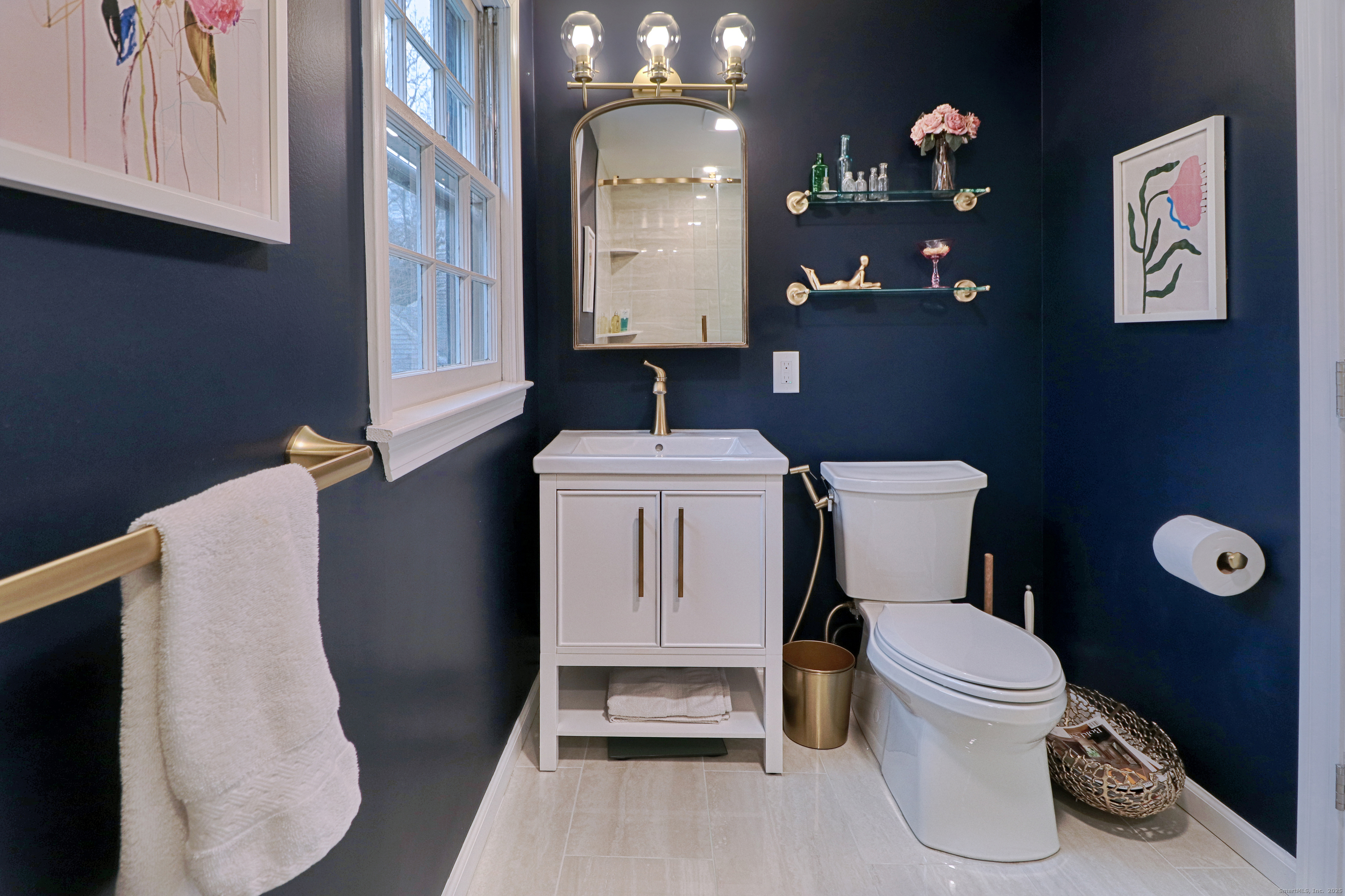 30 Falmouth Road Fairfield, CT 06825 - Photo 22 of 37 a bathroom with a toilet sink and mirror