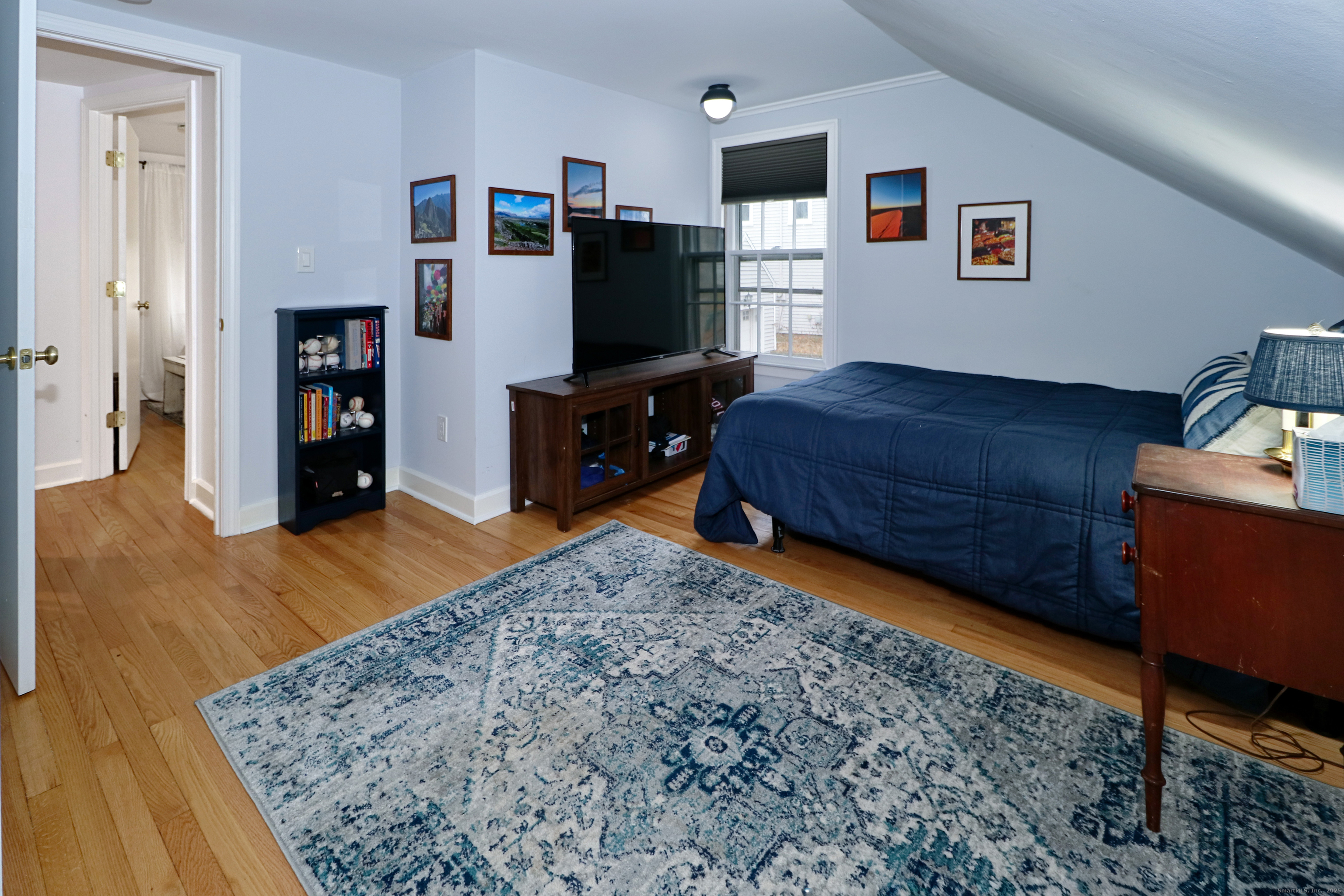 30 Falmouth Road Fairfield, CT 06825 - Photo 26 of 37 a living room with furniture and a flat screen tv