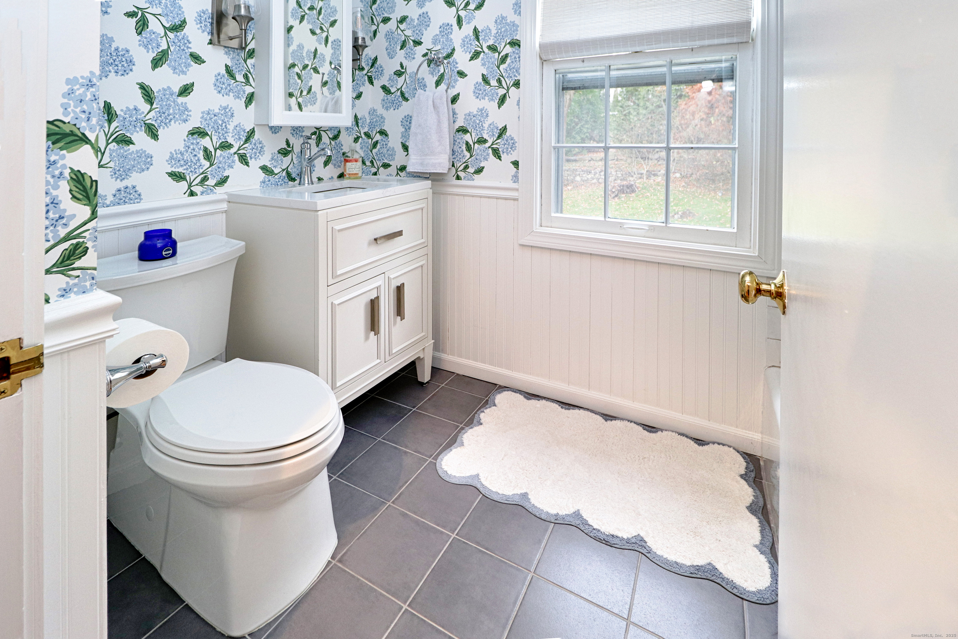 30 Falmouth Road Fairfield, CT 06825 - Photo 28 of 37 a bathroom with a sink toilet and window