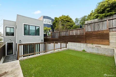 a view of a house with a fence