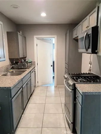 a kitchen with a stove and a sink