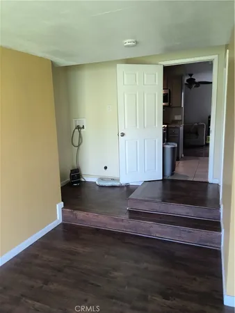 a view of entryway wooden floor and staircase