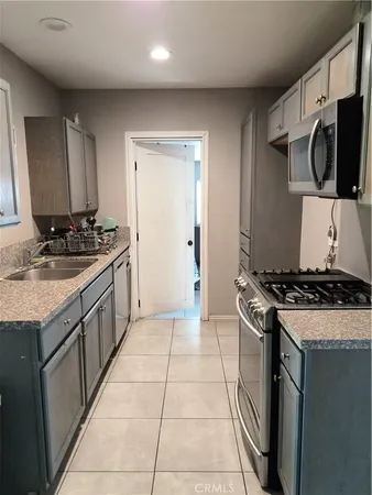 a kitchen with a stove and a sink
