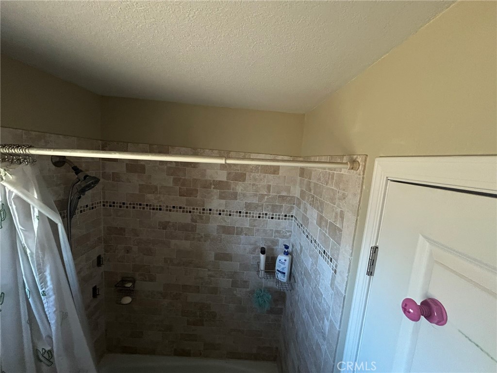 1749 Valley View Ridgecrest, CA 93555 - Photo 14 of 22 a bathroom with a shower