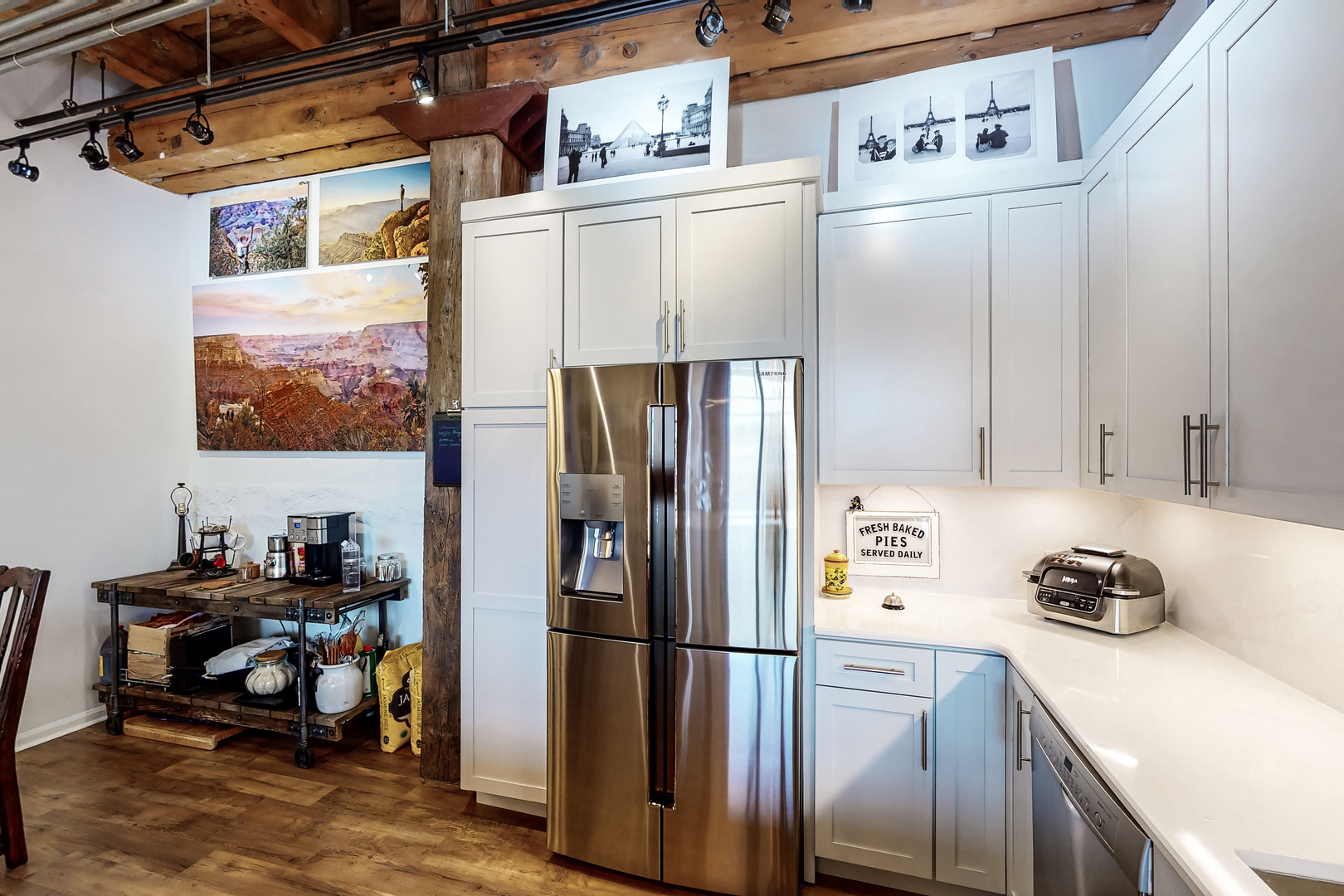 312 North May Street, Unit 3F Chicago, IL 60607 - Photo 5 of 25 a kitchen with a refrigerator a stove and a cabinets
