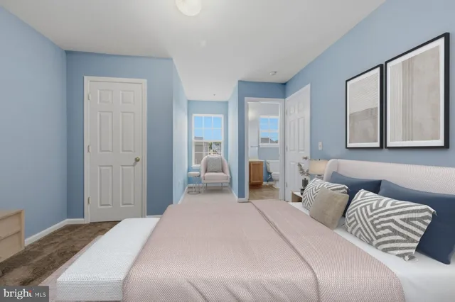 a bedroom with a bed and a painting