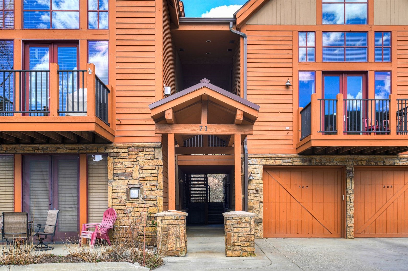 71 Antlers Gulch Road, Unit 303 Keystone, CO 80435 - Photo 31 of 35 a front view of a house with a yard