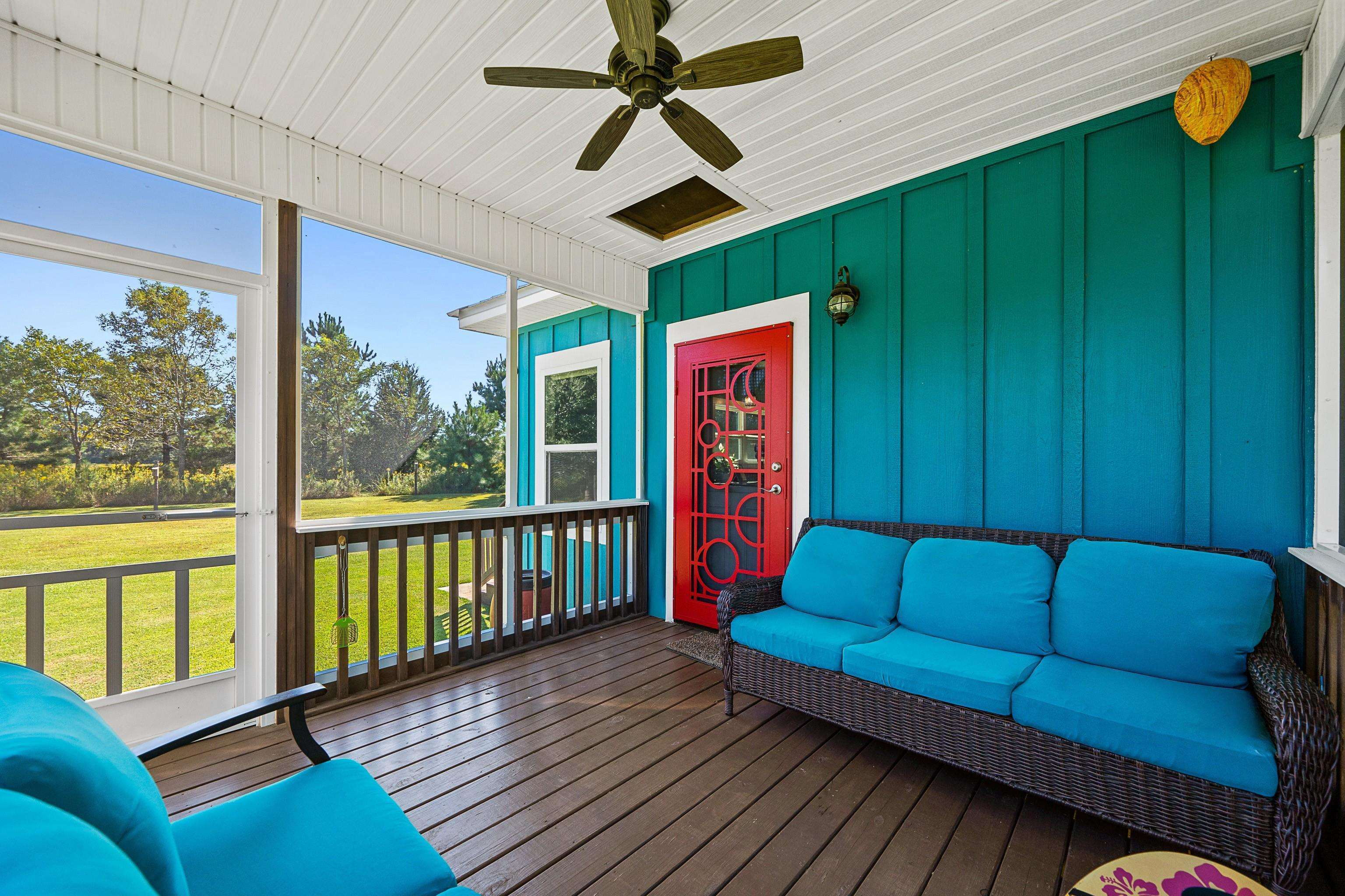 24616 Bretz Lane Elberta, AL 36530 - Photo 32 of 42 Screened side porch with beautiful ornate entry door to home.